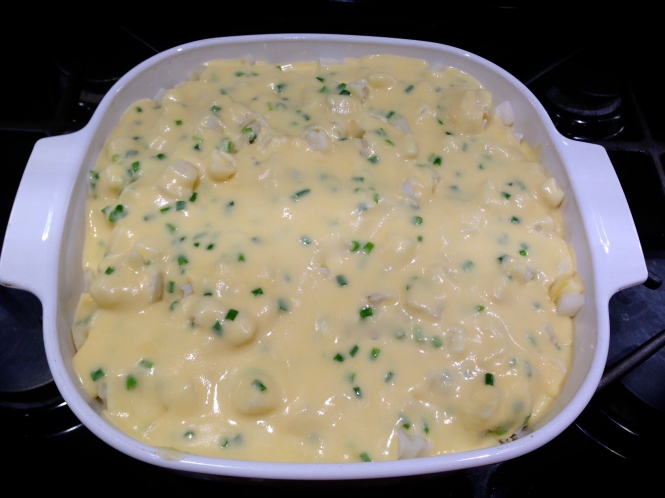 Pour the cheese sauce over the potatoes...