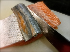 Removing the skin from the salmon